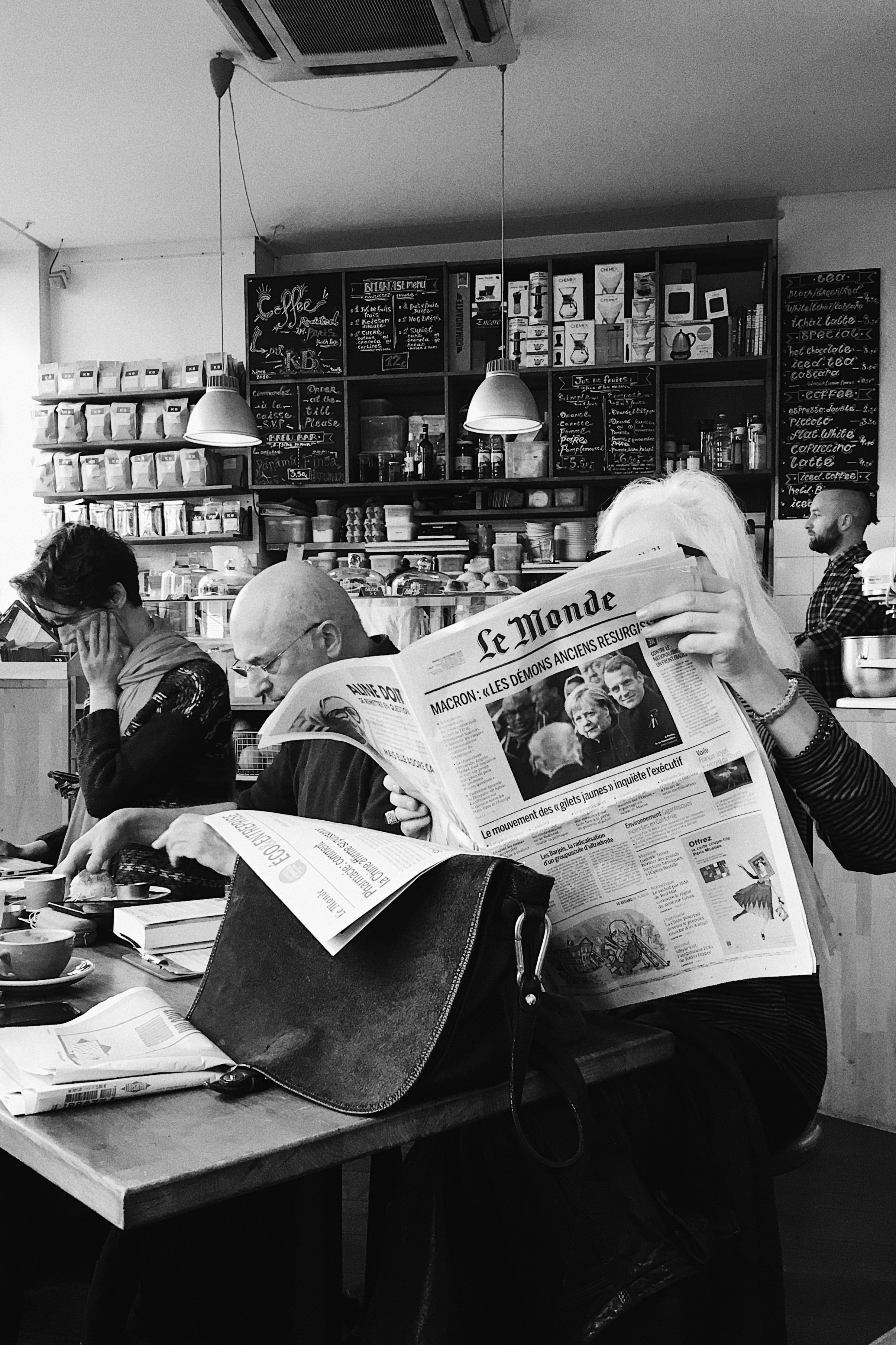 monochrome-photo-of-woman-holding-newspaper-1837412.jpg?time=1633511084224